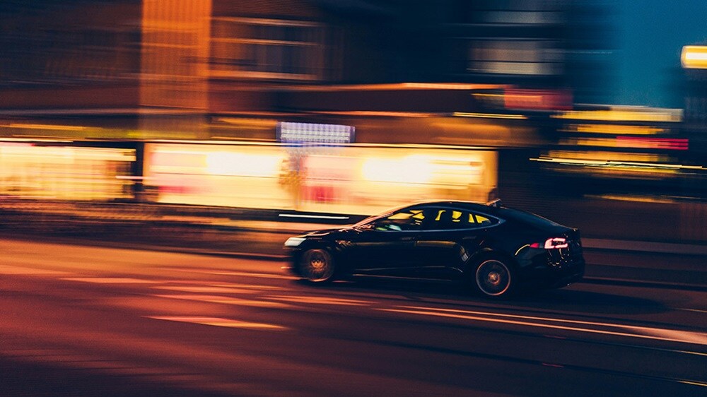 Tesla cruising through the streets of Amsterdam
