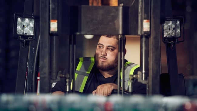 Warehouse employee moves goods