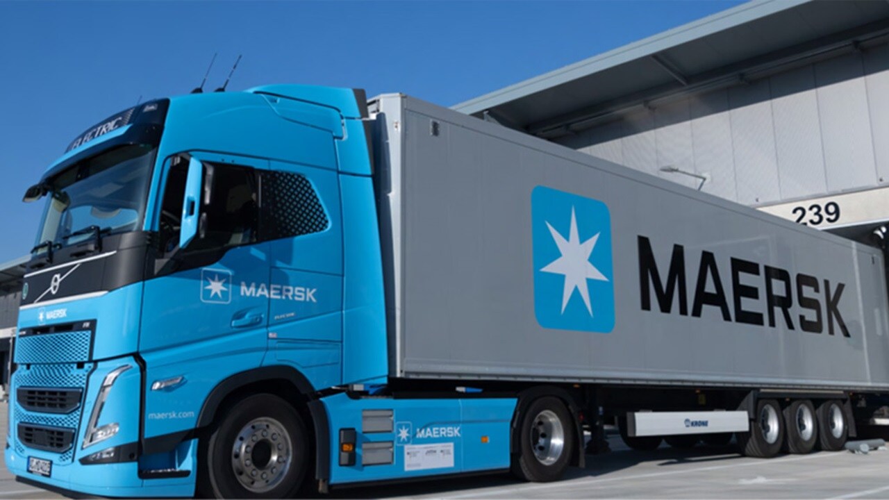 Blue Maersk truck parked at a loading dock with container.