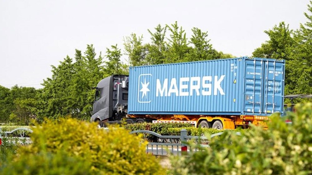 A container truck passing though highway.