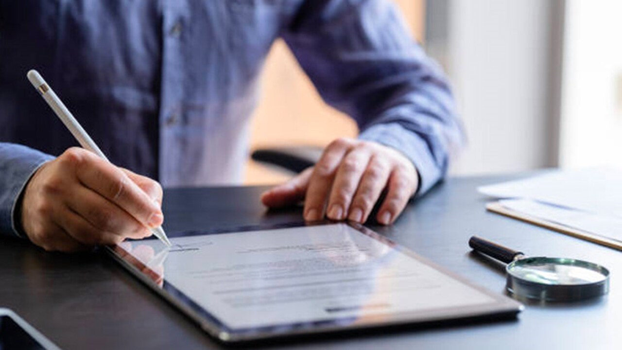 Man signing on contract